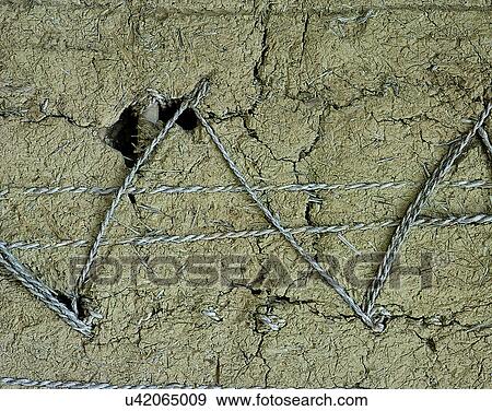 Stock Photo - wire, hole, wall, old, pattern, texture. Fotosearch