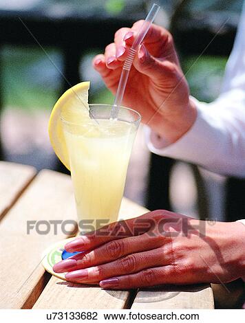 woman, outdoors, close-up, body parts, hand, beverage View Large Photo Image Stock Image - woman, outdoors, close-up, body parts, hand, beverage. Fotosearch