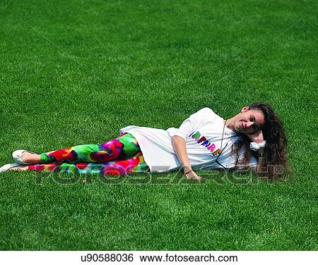 woman, outdoors, park, grass, lying down View Large Photo Image Stock Photograph - woman, outdoors, park, grass, lying down. Fotosearch
