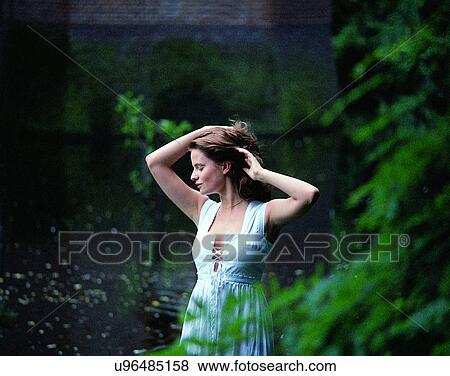 woman, outdoors, pretty, dress, water, scenery View Large Photo Image Stock Photo - woman, outdoors, pretty, dress, water, scenery. Fotosearch