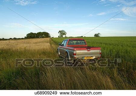 A pick up truck in a rural field View Large Photo Image Stock Photo - A pick up truck in a rural field. Fotosearch