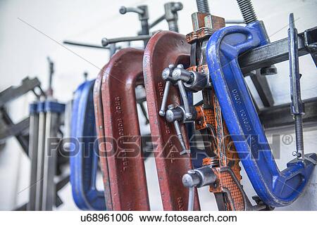 Stock Photograph - Assorted steel clamps in engineering factory. Fotosearch