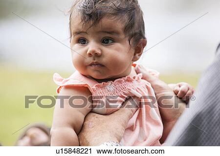 Stock Image - Baby in arms. Fotosearch