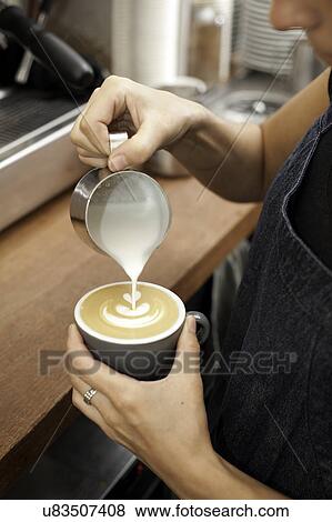 Barista preparing cappuccino View Large Photo Image Stock Photo - Barista preparing cappuccino. Fotosearch