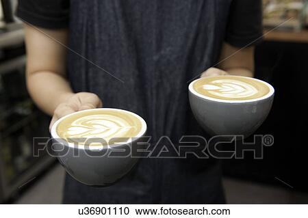 Barista serving cappuccino View Large Photo Image Stock Image - Barista serving cappuccino. Fotosearch