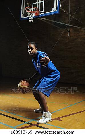 Basketball player bouncing ball View Large Photo Image Stock Photo - Basketball player bouncing ball. Fotosearch