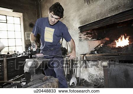 Stock Image - Blacksmith at work. Fotosearch