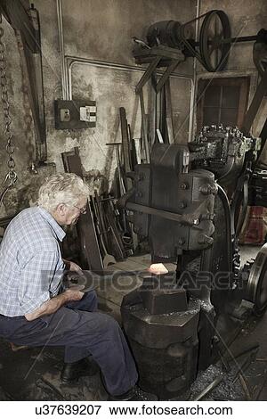 Blacksmith at work View Large Photo Image Stock Photo - Blacksmith at work. Fotosearch