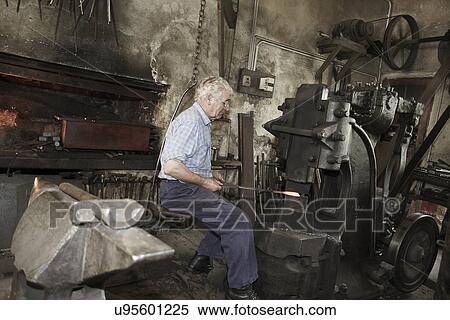 Stock Photography - Blacksmith at work. Fotosearch