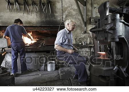 Stock Photo - Blacksmiths at work. Fotosearch