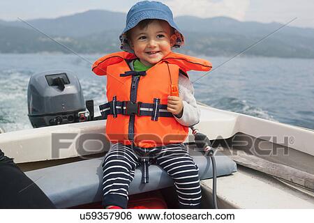 Boy enjoying boat ride View Large Photo Image Stock Photograph - Boy enjoying boat ride. Fotosearch