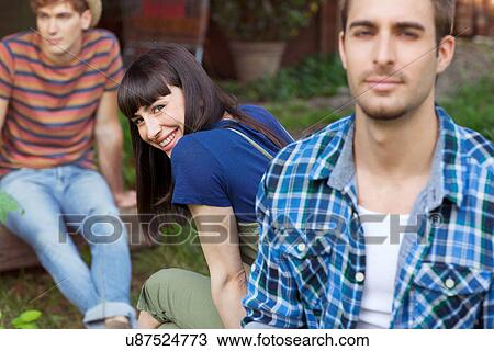 Brunette woman looking over shoulder towards camera View Large Photo Image Stock Image - Brunette woman looking over shoulder towards camera. Fotosearch