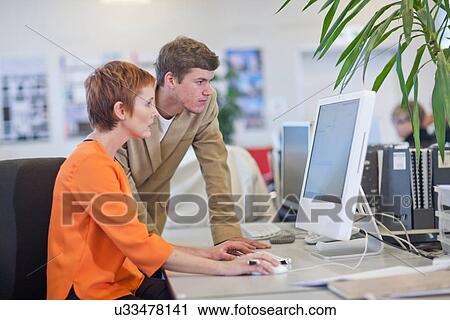 Businesspeople using computer View Large Photo Image Stock Image - Businesspeople using computer. Fotosearch
