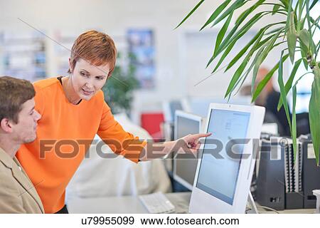 Businesspeople using computer View Large Photo Image Stock Photo - Businesspeople using computer. Fotosearch