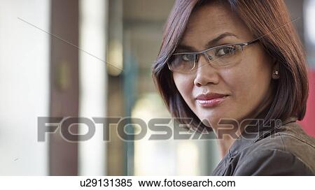 Stock Photography - Businesswoman wearing glasses. Fotosearch