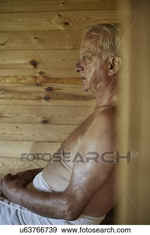 Close up of senior man sitting in sauna View Large Photo Image Stock Photo - Close up of senior man sitting in sauna. Fotosearch