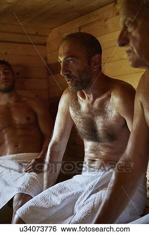 Close up of three men sitting in sauna View Large Photo Image Stock Photograph - Close up of three men sitting in sauna. Fotosearch