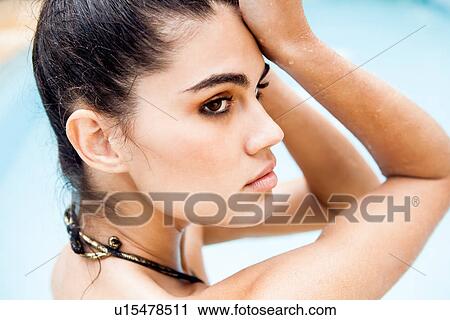 Stock Image - Close up portrait of beautiful young woman. Fotosearch