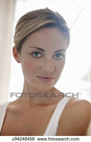 Stock Photo - Close up portrait of confident young woman. Fotosearch