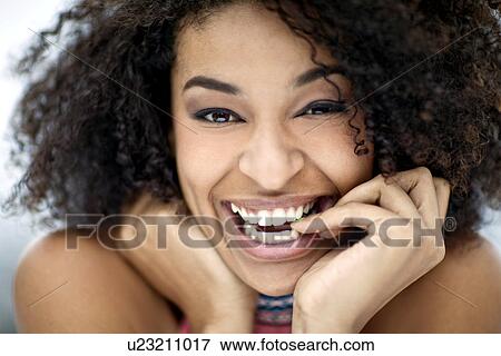 Stock Photo - Close up portrait of happy young woman. Fotosearch