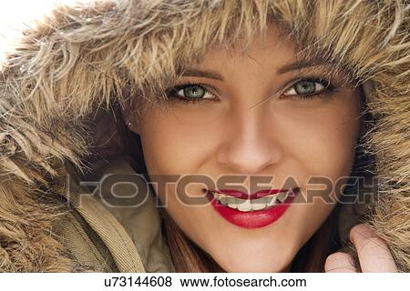 Close up portrait of young woman in parka hood View Large Photo Image Stock Photo - Close up portrait of young woman in parka hood. Fotosearch