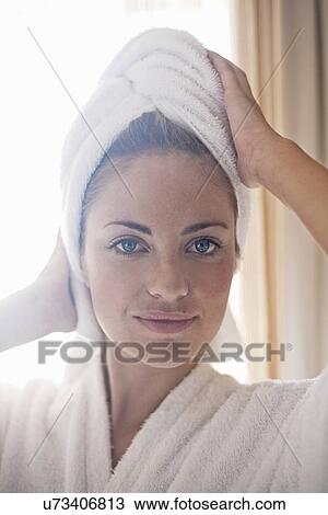 Close up portrait of young woman with towel wrapped hair View Large Photo Image Stock Image - Close up portrait of young woman with towel wrapped hair. Fotosearch