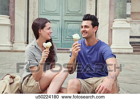 Couple eating ice creams, Santa Maria Novella square, Florence, Tuscany, Italy View Large Photo Image Stock Image - Couple eating ice creams, Santa Maria Novella square, Florence, Tuscany, Italy. Fotosearch