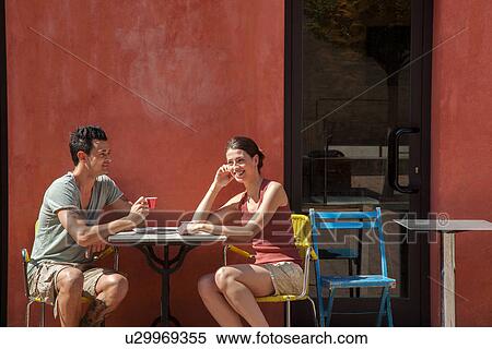 Couple sitting outside cafe, Florence, Tuscany, Italy View Large Photo Image Stock Photography - Couple sitting outside cafe, Florence, Tuscany, Italy. Fotosearch