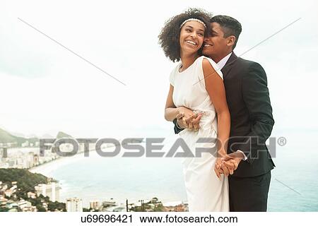 Stock Image - Couple smiling, Alto Vidigal, Rio de Janeiro, Brazil. Fotosearch
