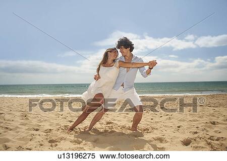 Couple tangoing on beach View Large Photo Image Stock Photography - Couple tangoing on beach. Fotosearch