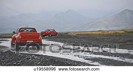 Customised SUVs driving through rivers, Thorsmork, Iceland View Large Photo Image Stock Photograph - Customised SUVs driving through rivers, Thorsmork, Iceland. Fotosearch
