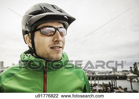 Stock Image - Discovering city by bike. Fotosearch