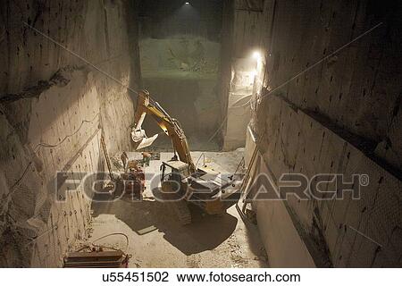 Excavator in a marble quarry View Large Photo Image Stock Image - Excavator in a marble quarry. Fotosearch