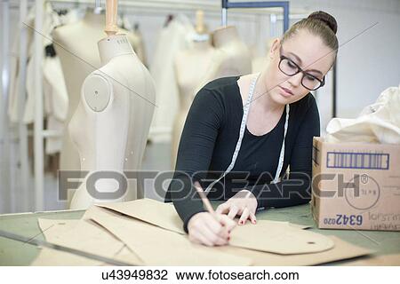 Stock Image - Fashion design student in class. Fotosearch