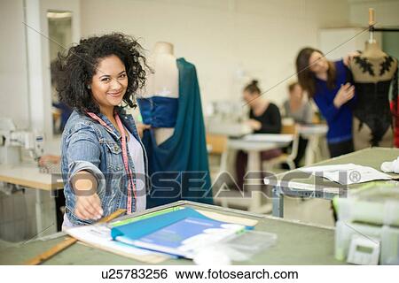 Stock Photograph - Fashion design students in class. Fotosearch