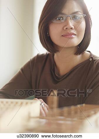 Female architect with model View Large Photo Image Stock Image - Female architect with model. Fotosearch