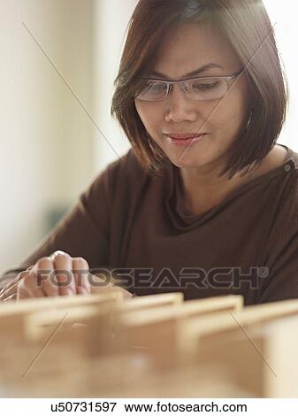 Female architect with model View Large Photo Image Stock Photo - Female architect with model. Fotosearch