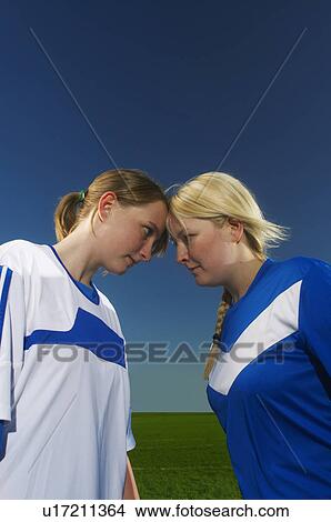 Picture - Female football competitors head to head. Fotosearch