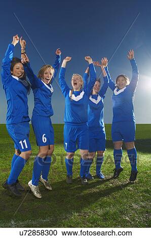 Female football team cheering View Large Photo Image Stock Image - Female football team cheering. Fotosearch