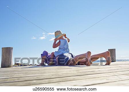 Female toddler and father on jetty, Utvalnas, Gavle, Sweden View Large Photo Image Stock Photography - Female toddler and father on jetty, Utvalnas, Gavle, Sweden. Fotosearch