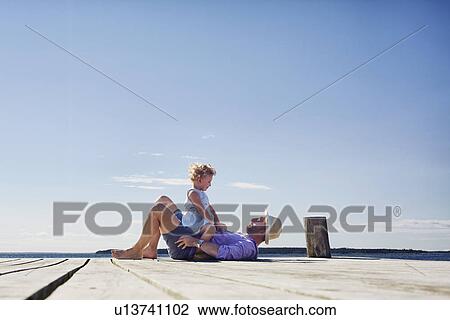 Female toddler and father on pier, Utvalnas, Gavle, Sweden View Large Photo Image Stock Image - Female toddler and father on pier, Utvalnas, Gavle, Sweden. Fotosearch