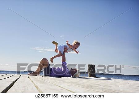 Female toddler and father playing, Utvalnas, Gavle, Sweden View Large Photo Image Stock Photo - Female toddler and father playing, Utvalnas, Gavle, Sweden. Fotosearch