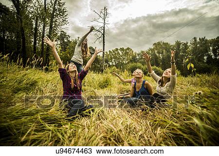 Five young women watching kite View Large Photo Image Stock Image - Five young women watching kite. Fotosearch