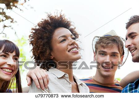 Stock Image - Four young friends. Fotosearch