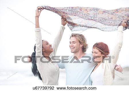 Friends having fun on beach View Large Photo Image Stock Image - Friends having fun on beach. Fotosearch