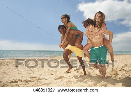 Friends having fun on beach View Large Photo Image Stock Photo - Friends having fun on beach. Fotosearch