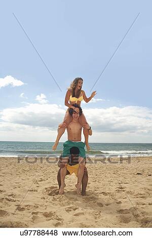 Friends having fun on beach View Large Photo Image Stock Photo - Friends having fun on beach. Fotosearch