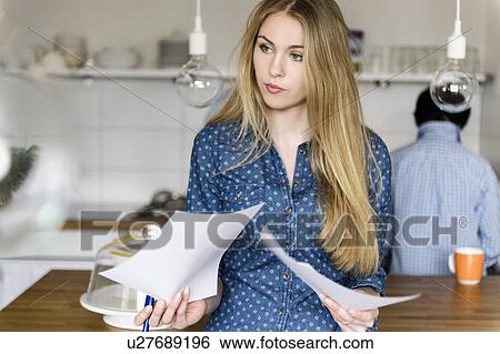 Girl with paper in hands View Large Photo Image Stock Photograph - Girl with paper in hands. Fotosearch