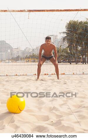 Picture - Goalkeeper in defence postion on beach. Fotosearch