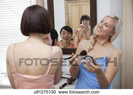 Group of young female friends getting ready View Large Photo Image Stock Image - Group of young female friends getting ready. Fotosearch